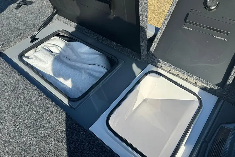 Slide: The Image of Open storage compartments in a 2026 Vexus AVX 2080 boat interior. - 17