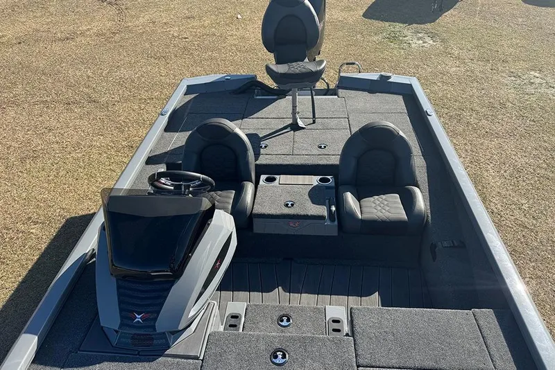 Slide: The Image of 2026 Vexus AVX 2080 boat interior with seating and steering console on grassy background. - 20