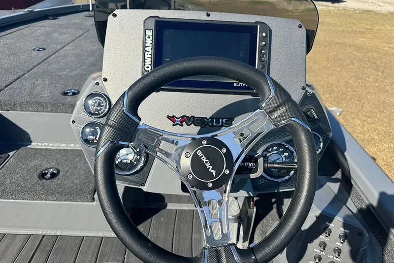 Slide: The Image of Steering console of 2026 Vexus AVX 2080 boat with digital display and controls. - 23