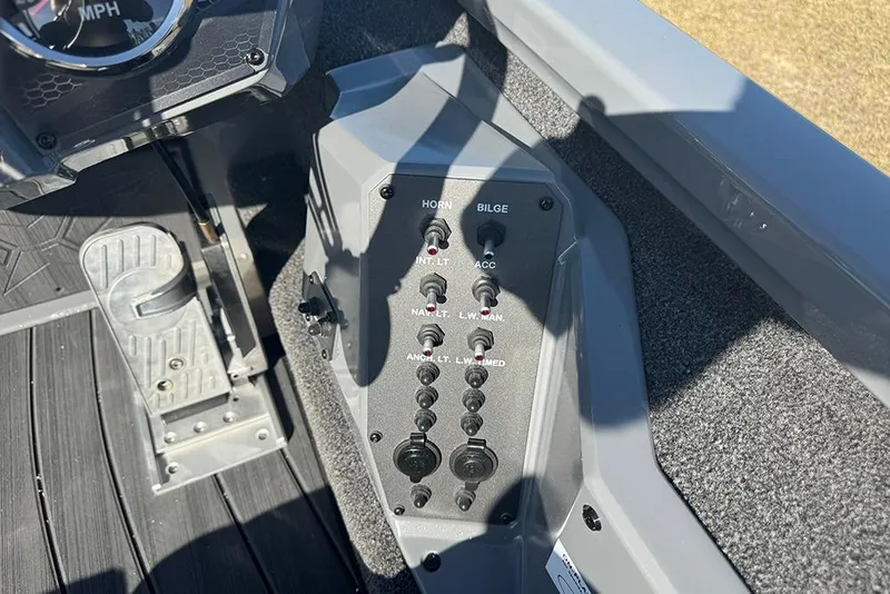 Slide: The Image of 2026 Vexus AVX 2080 boat control panel with switches and foot pedal. - 25