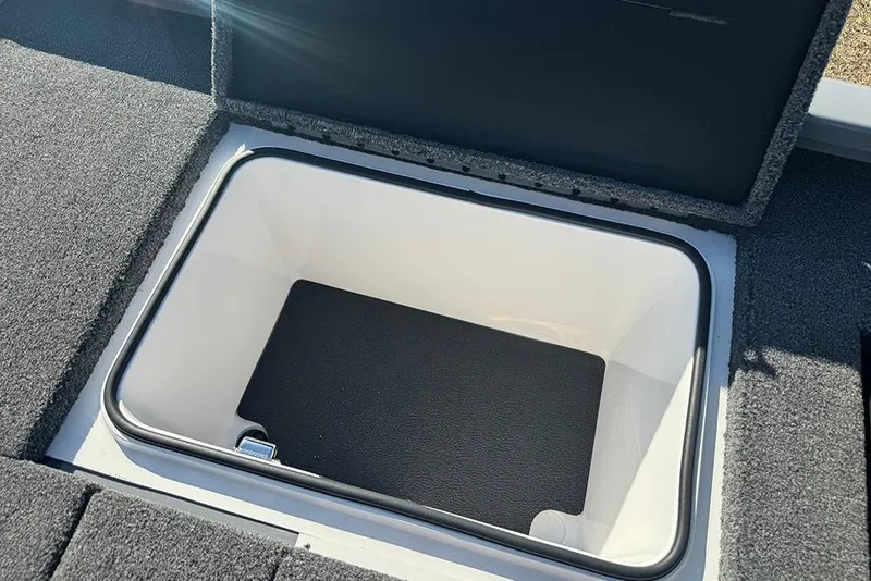 Slide: The Image of Open storage compartment in 2026 Vexus AVX 2080 boat, featuring carpeted interior. - 32