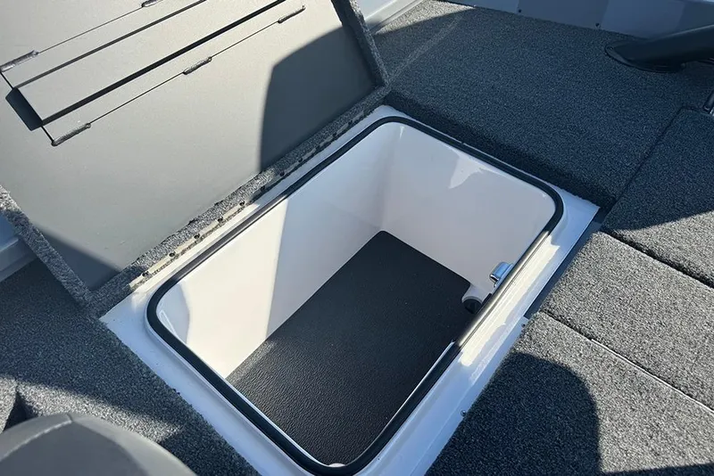 Slide: The Image of Open storage compartment in 2026 Vexus AVX 2080 boat, featuring carpeted interior. - 33