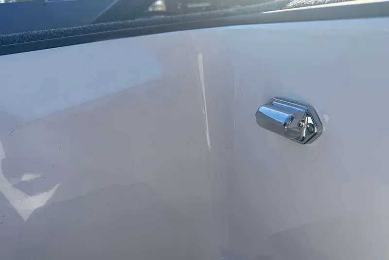 Slide: The Image of Close-up of a chrome detail on a 2026 Vexus AVX 2080 boat. - 34