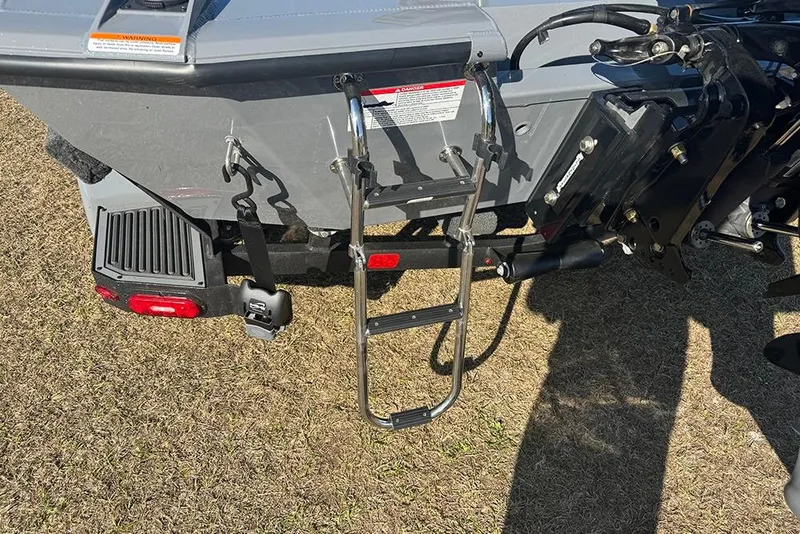 Slide: The Image of 2026 Vexus AVX 2080 boat rear view with ladder and motor components. - 5