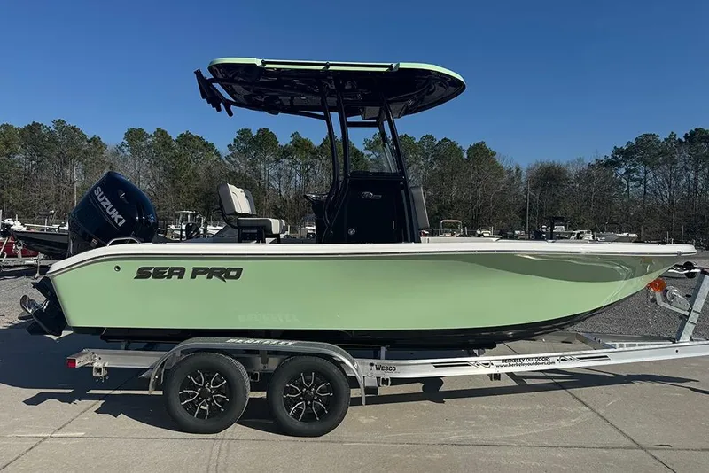 The Image of 2026 Sea Pro 202 Center Console boat on trailer, featuring Suzuki outboard motor. - 1