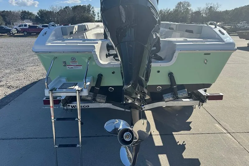 Slide: The Image of 2026 Sea Pro 202 Center Console boat with outboard motor and swim ladder. - 10