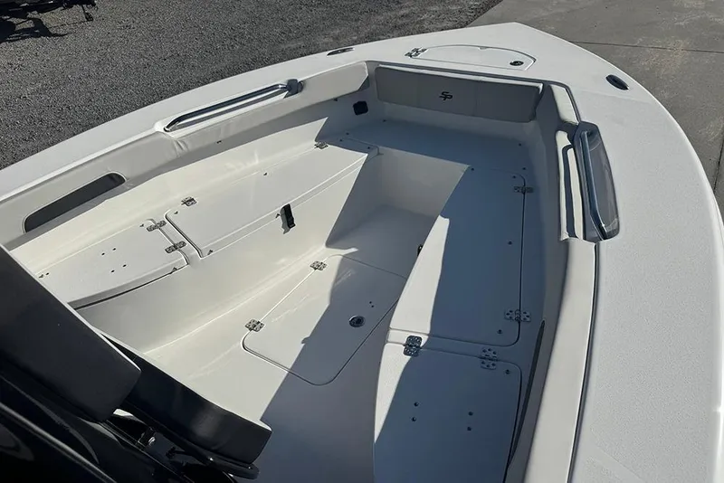 Slide: The Image of 2026 Sea Pro 202 Center Console boat interior with storage compartments and seating. - 11