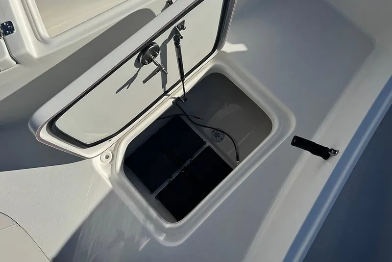 Slide: The Image of Open storage compartment on 2026 Sea Pro 202 Center Console boat. - 14