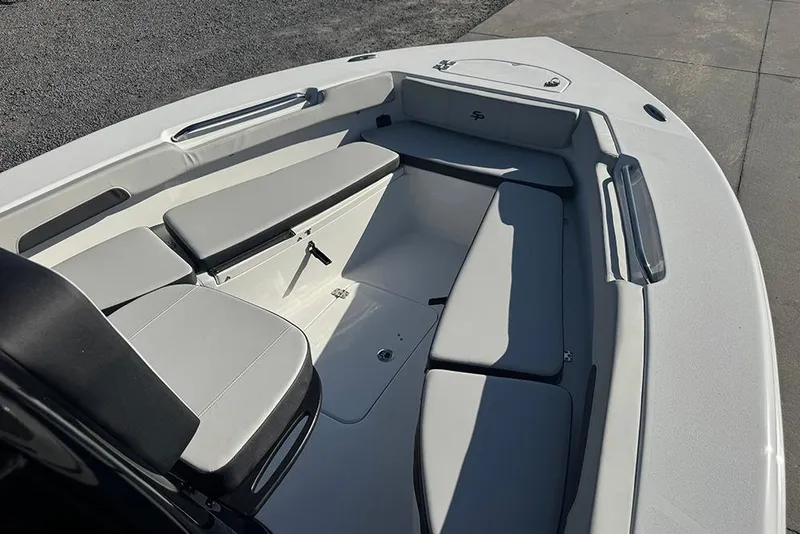 Slide: The Image of 2026 Sea Pro 202 Center Console boat interior with cushioned seating and storage. - 20