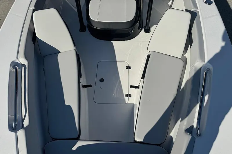 Slide: The Image of 2026 Sea Pro 202 Center Console boat interior with cushioned seating and storage. - 21