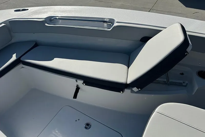Slide: The Image of 2026 Sea Pro 202 Center Console boat interior with cushioned seating and storage. - 22