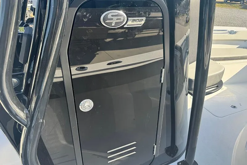 Slide: The Image of 2026 Sea Pro 202 Center Console boat, black console detail with logo and handle. - 23