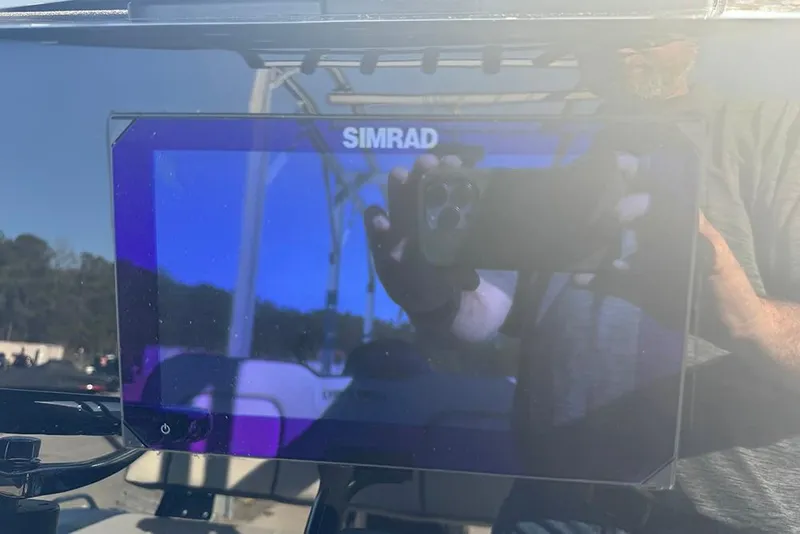 Slide: The Image of Simrad display on 2026 Sea Pro 202 Center Console boat dashboard. - 26