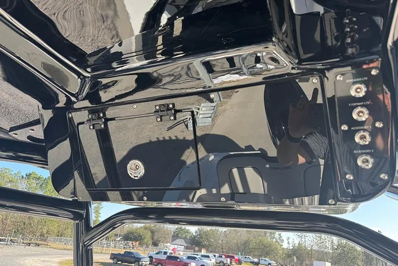 Slide: The Image of 2026 Sea Pro 202 Center Console boat dashboard with control panel and switches. - 32