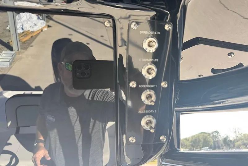 Slide: The Image of Control panel of a 2026 Sea Pro 202 Center Console boat with labeled switches. - 34