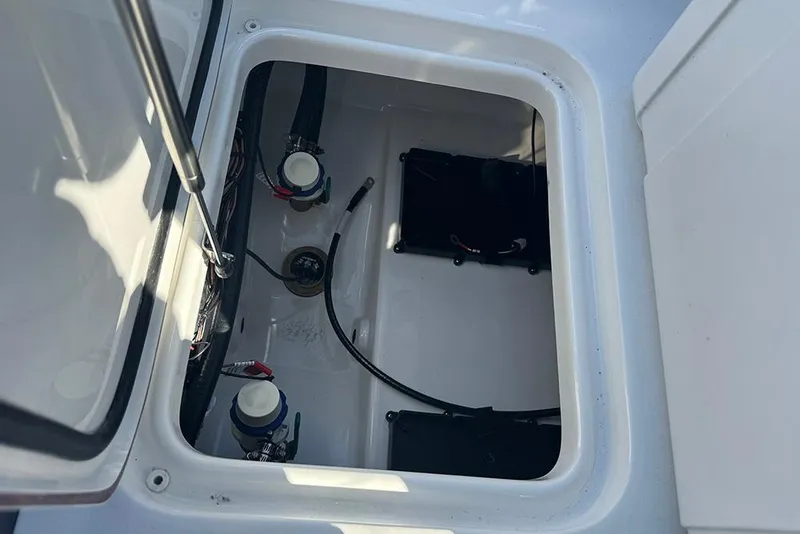 Slide: The Image of 2026 Sea Pro 202 Center Console boat storage compartment with wiring and components. - 37