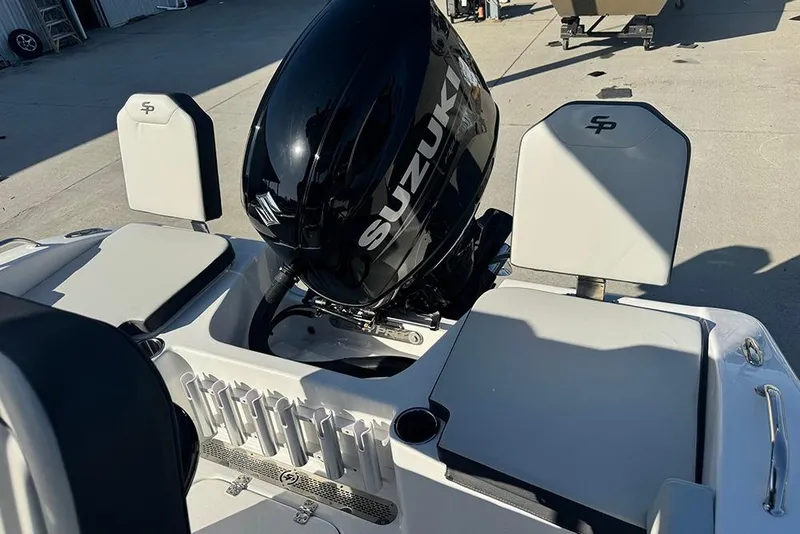 Slide: The Image of 2026 Sea Pro 202 Center Console boat with Suzuki outboard motor, featuring seating and rod holders. - 42