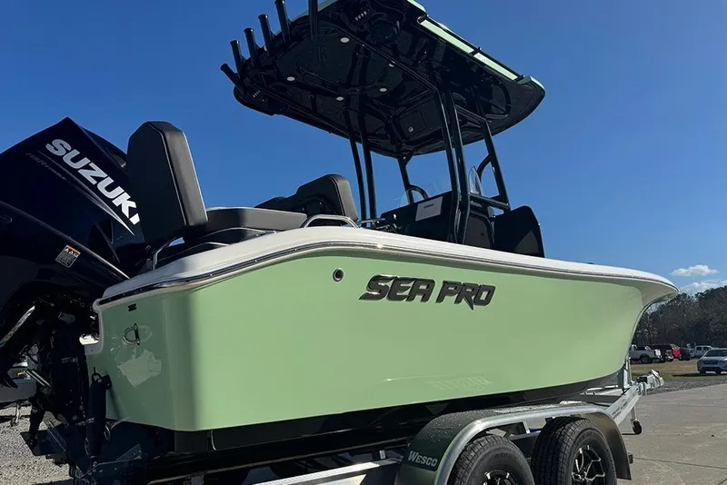 Slide: The Image of 2026 Sea Pro 202 Center Console boat on trailer, featuring Suzuki outboard motor. - 46
