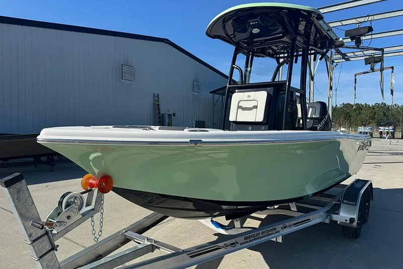 Slide: The Image of 2026 Sea Pro 202 Center Console boat on trailer, outdoor setting. - 5