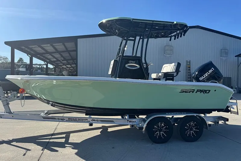 Slide: The Image of 2026 Sea Pro 202 Center Console boat on trailer, outdoor setting. - 6