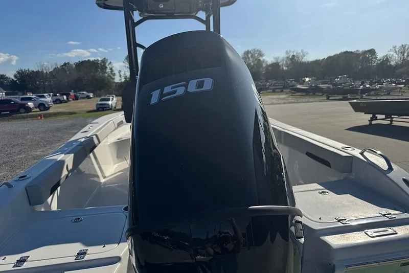 Slide: The Image of 2026 Sea Pro 202 Center Console boat with 150 horsepower engine, parked outdoors. - 8