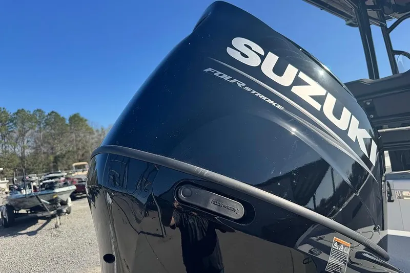 Slide: The Image of 2026 Sea Pro 202 Center Console with Suzuki four-stroke engine, outdoor setting. - 9