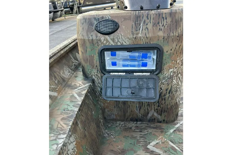 Slide: The Image of Camouflage interior of 2026 G3 Gator Tough 17 SC boat with storage compartments. - 11