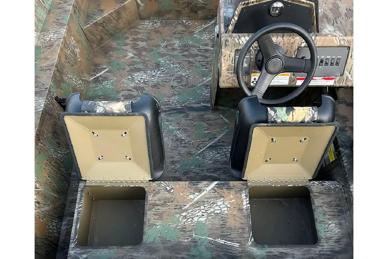 Slide: The Image of 2026 G3 Gator Tough 17 SC boat interior with camo seats and steering console. - 13