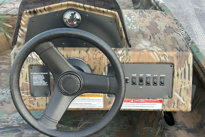 Slide: The Image of Steering console of 2026 G3 Gator Tough 17 SC boat with camo design. - 14