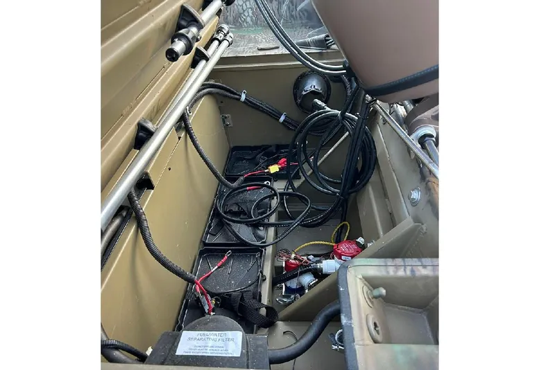Slide: The Image of Interior view of 2026 G3 Gator Tough 17 SC boat showing wiring and components. - 16