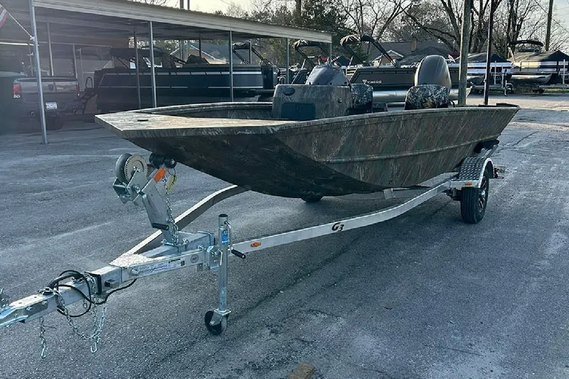 Slide: The Image of 2026 G3 Gator Tough 17 SC boat on trailer, parked outdoors. - 4