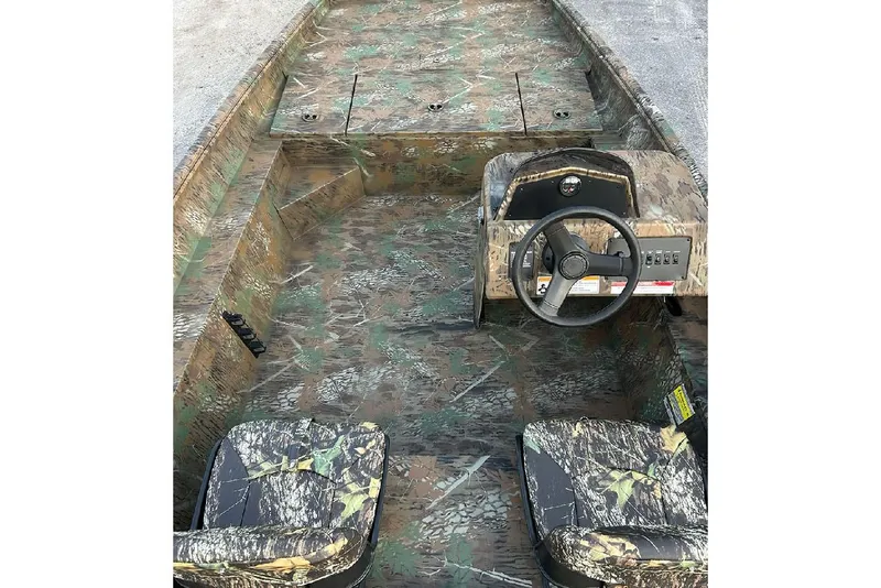 Slide: The Image of 2026 G3 Gator Tough 17 SC boat interior with camouflage design and steering console. - 8