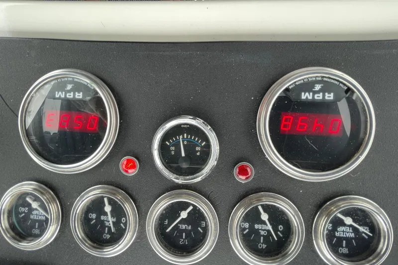 Slide: The Image of 1975 Uniflite Sport Fisher 42 dashboard with RPM, oil, and temperature gauges. - 10