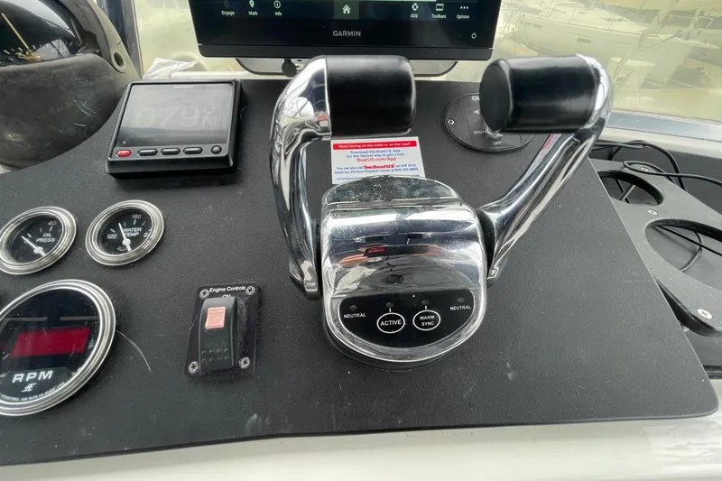 Slide: The Image of Control panel of a 1975 Uniflite Sport Fisher 42 with throttle and gauges. - 11