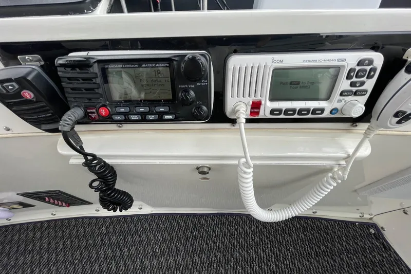 Slide: The Image of 1975 Uniflite Sport Fisher 42 boat radio equipment with communication devices and controls. - 12