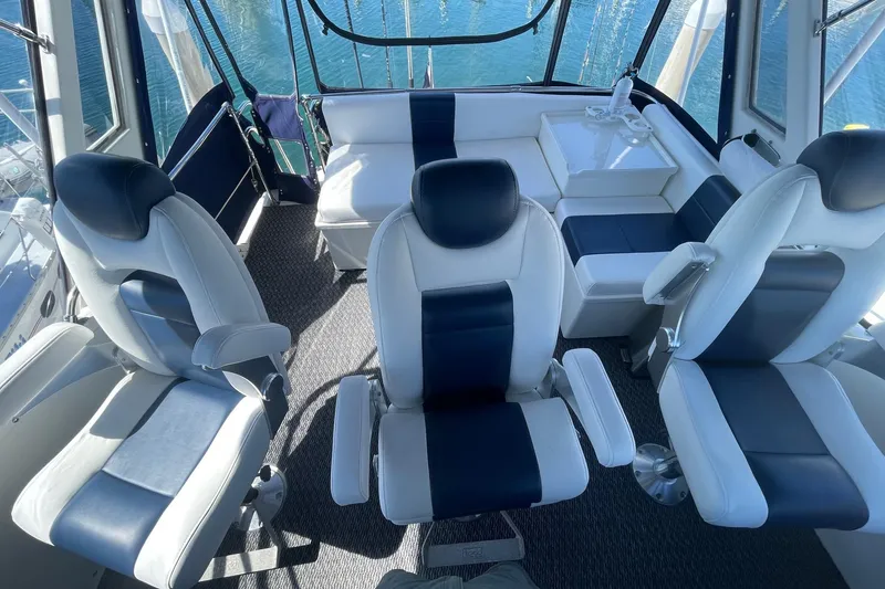Slide: The Image of Interior of 1975 Uniflite Sport Fisher 42 with modern seating and ocean view. - 13