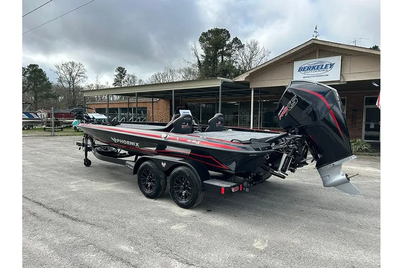 Slide: The Image of 2026 Phoenix 921 Elite X boat with powerful engine, parked outside Berkeley Outdoors. - 11