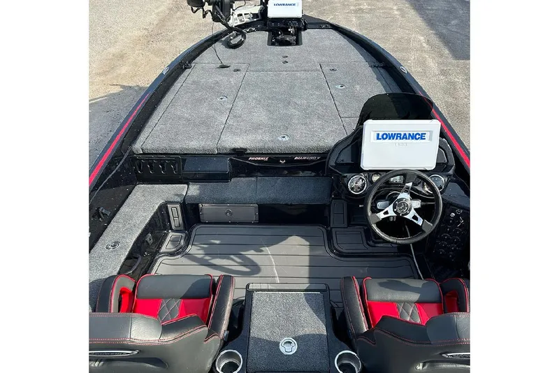 Slide: The Image of 2026 Phoenix 921 Elite X boat interior with Lowrance electronics and sleek seating. - 12