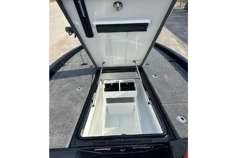 Slide: The Image of Open storage compartment of 2026 Phoenix 921 Elite X boat, showcasing interior space. - 14