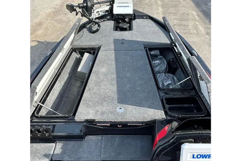 Slide: The Image of 2026 Phoenix 921 Elite X boat interior with storage compartments and fishing equipment. - 15