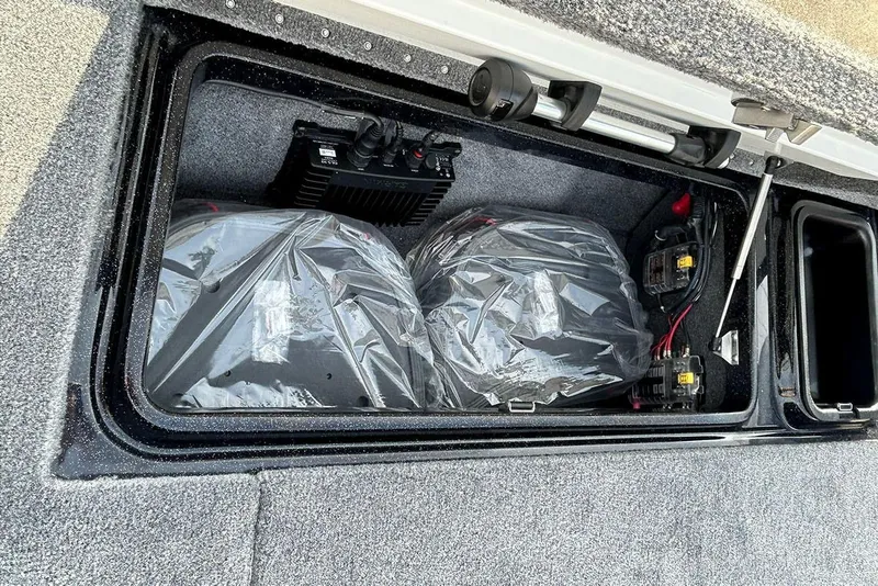 Slide: The Image of 2026 Phoenix 921 Elite X storage compartment with batteries and wiring. - 16