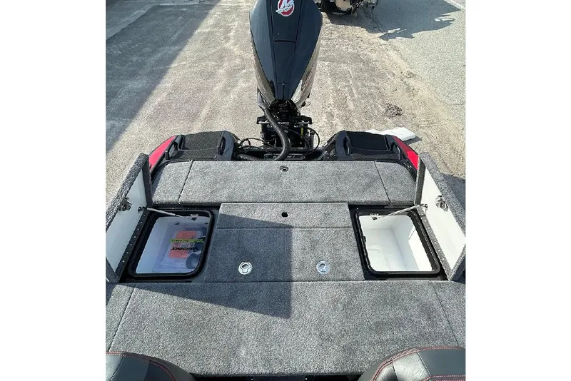 Slide: The Image of 2026 Phoenix 921 Elite X boat deck with open storage compartments. - 17