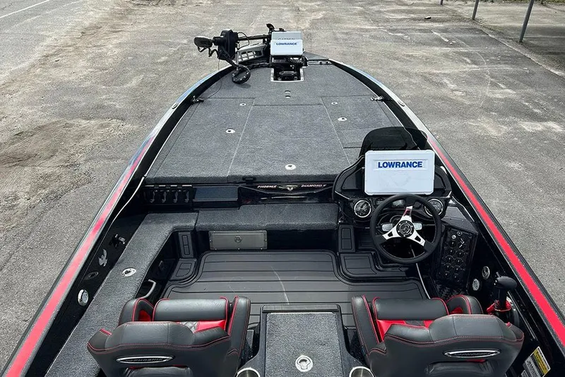 Slide: The Image of 2026 Phoenix 921 Elite X boat interior with Lowrance electronics and dual seating. - 25