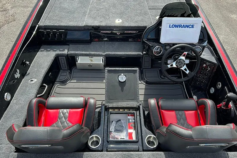Slide: The Image of 2026 Phoenix 921 Elite X boat interior with red and black seats, steering wheel, and Lowrance display. - 30