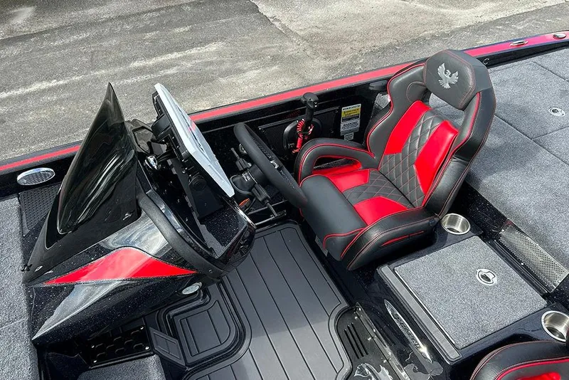 Slide: The Image of 2026 Phoenix 921 Elite X boat interior with red and black seating and modern dashboard. - 32