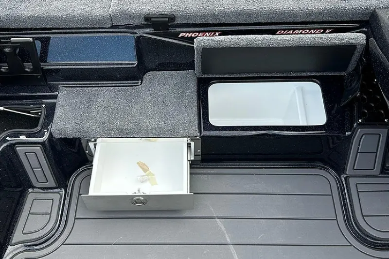 Slide: The Image of Interior storage compartments of 2026 Phoenix 921 Elite X boat, featuring organized layout. - 33
