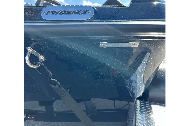 Slide: The Image of 2026 Phoenix 921 Elite X boat rear view with branding and serial number. - 35