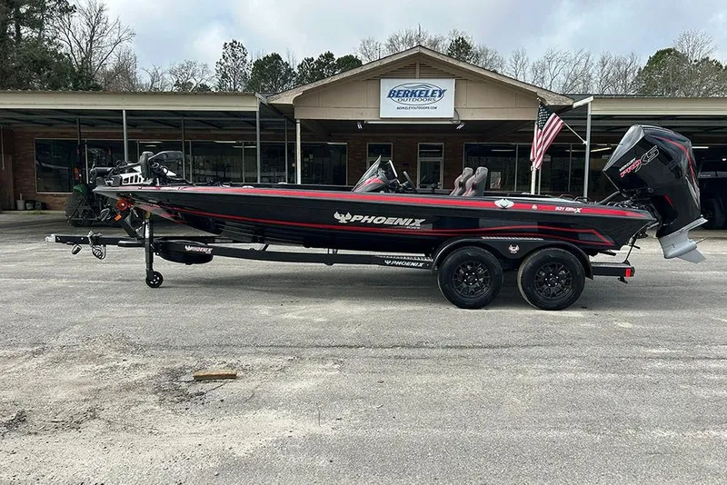 Slide: The Image of 2026 Phoenix 921 Elite X boat parked outside Berkeley Outdoors store. - 9