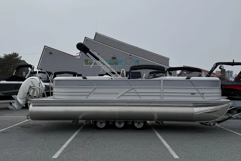 The Image of 2026 Berkshire 24 RFX CTS pontoon boat parked at a watersports facility. - 1