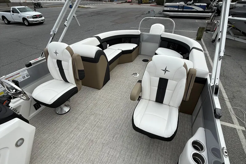 Slide: The Image of 2026 Berkshire 24 RFX CTS pontoon boat interior with plush seating and modern design. - 10